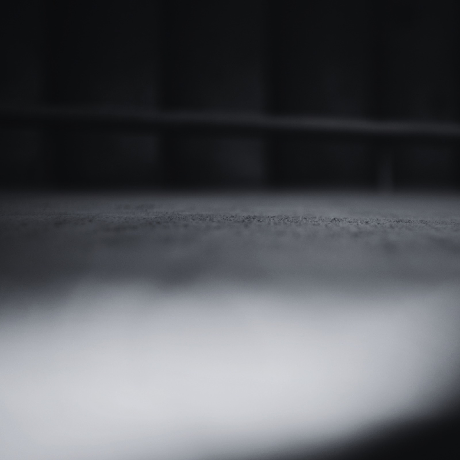 An empty training floor in low light, black and white